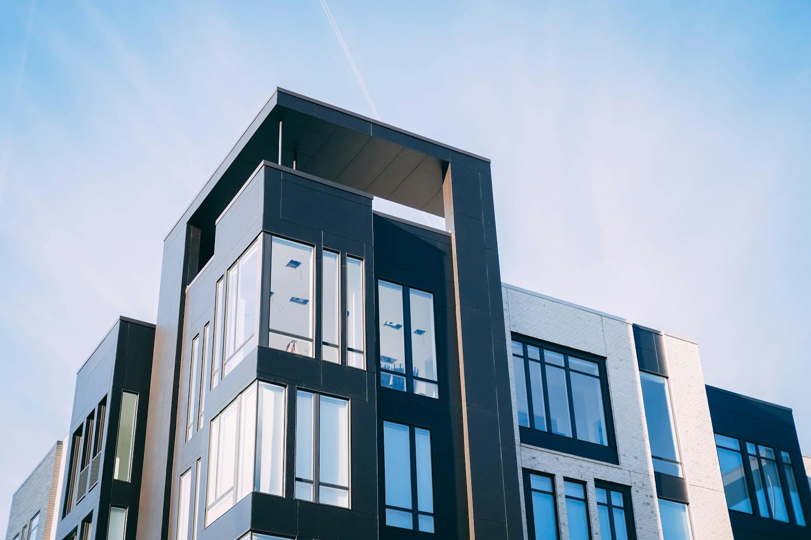 Mid-rise multifamily apartment building, the most common asset acquired through multifamily syndication