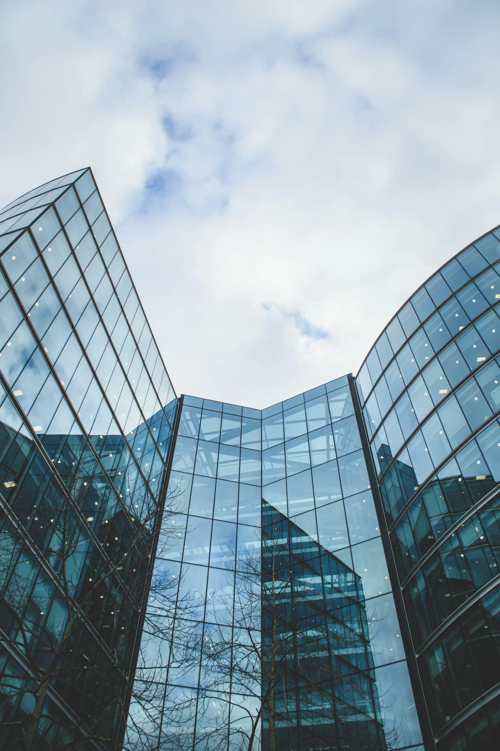 Architectural detail of a commercial building — the kind of asset a real estate sponsor finds, finances, and operates