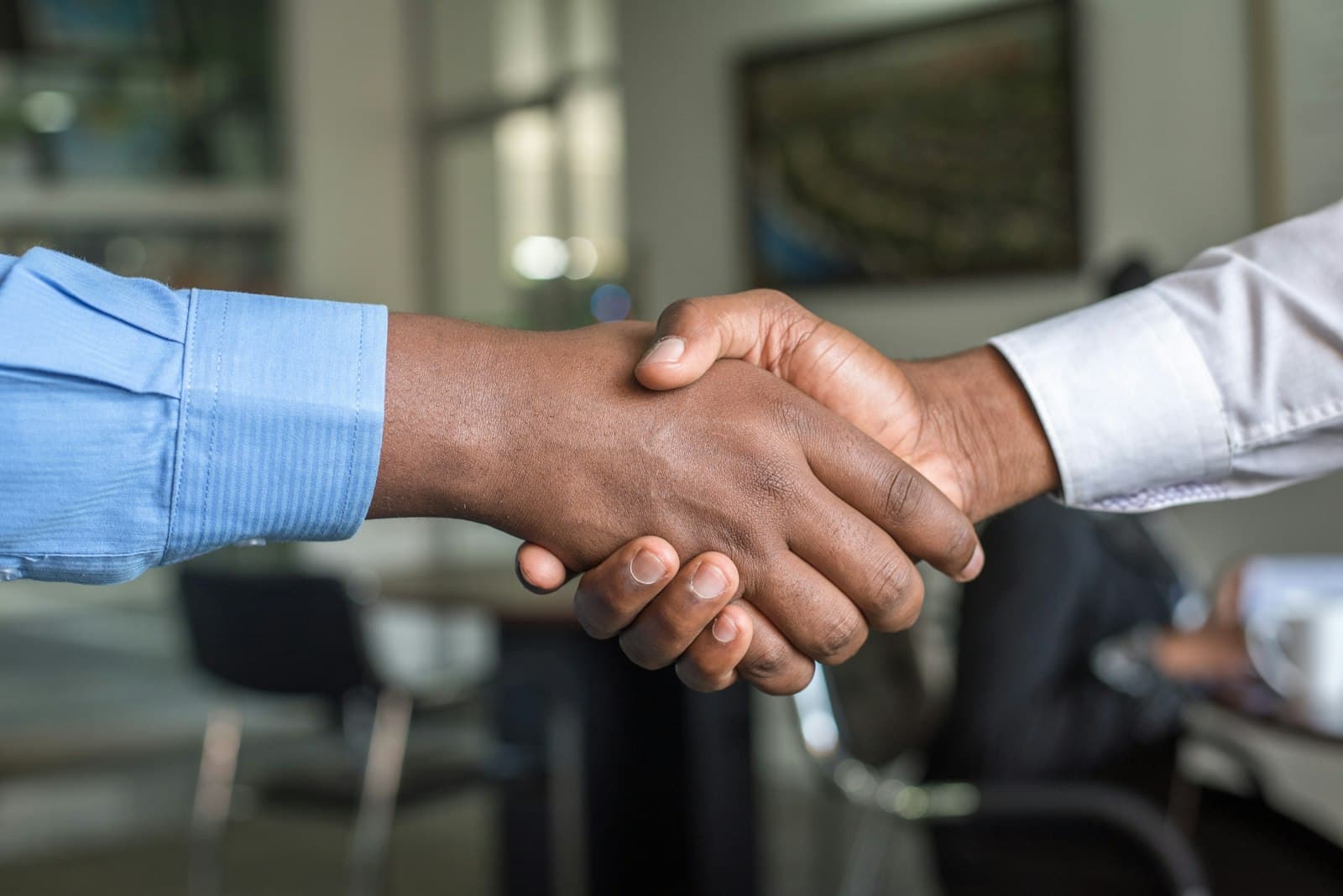 Sponsor and investor shaking hands to close a commitment during a private capital raise
